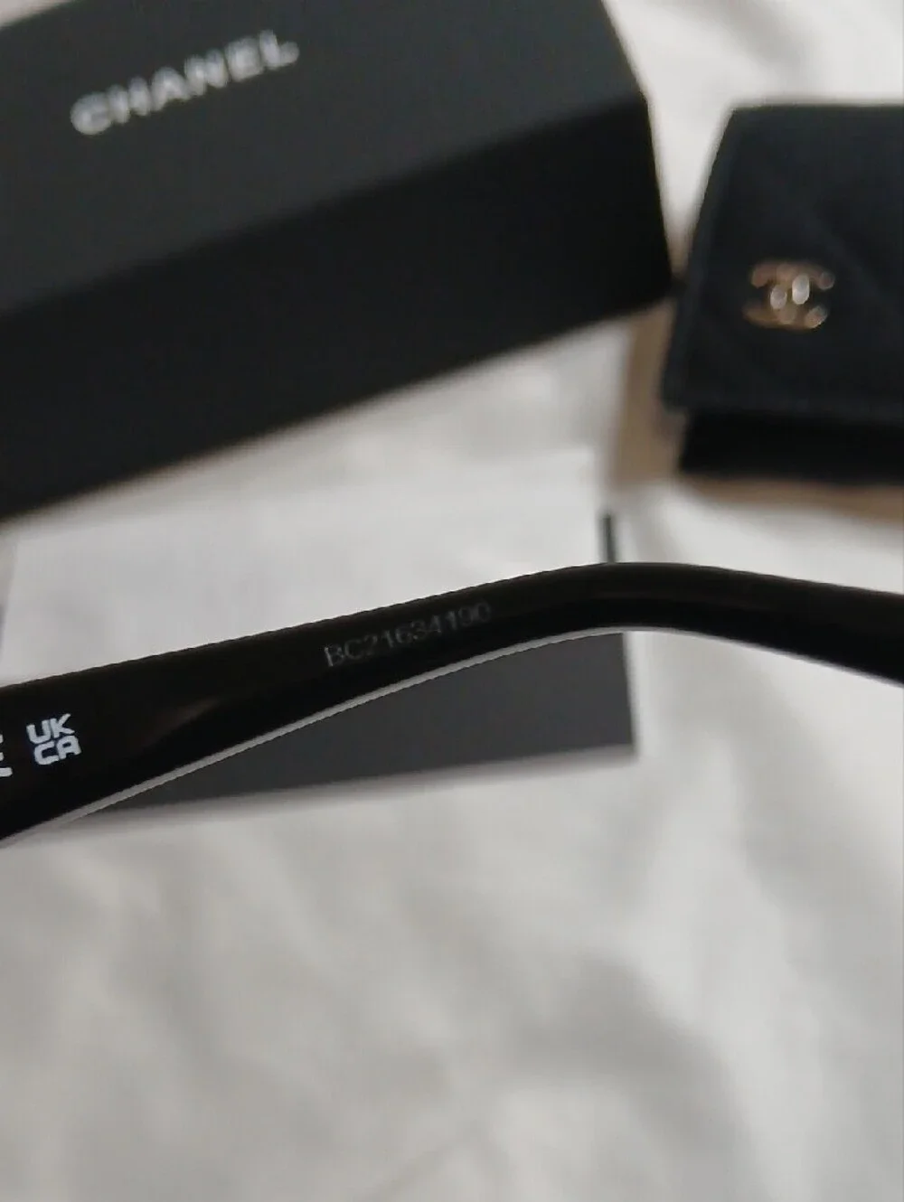 CHANEL Black Cat-Eye Sunglasses with White/Silver CC Emblem